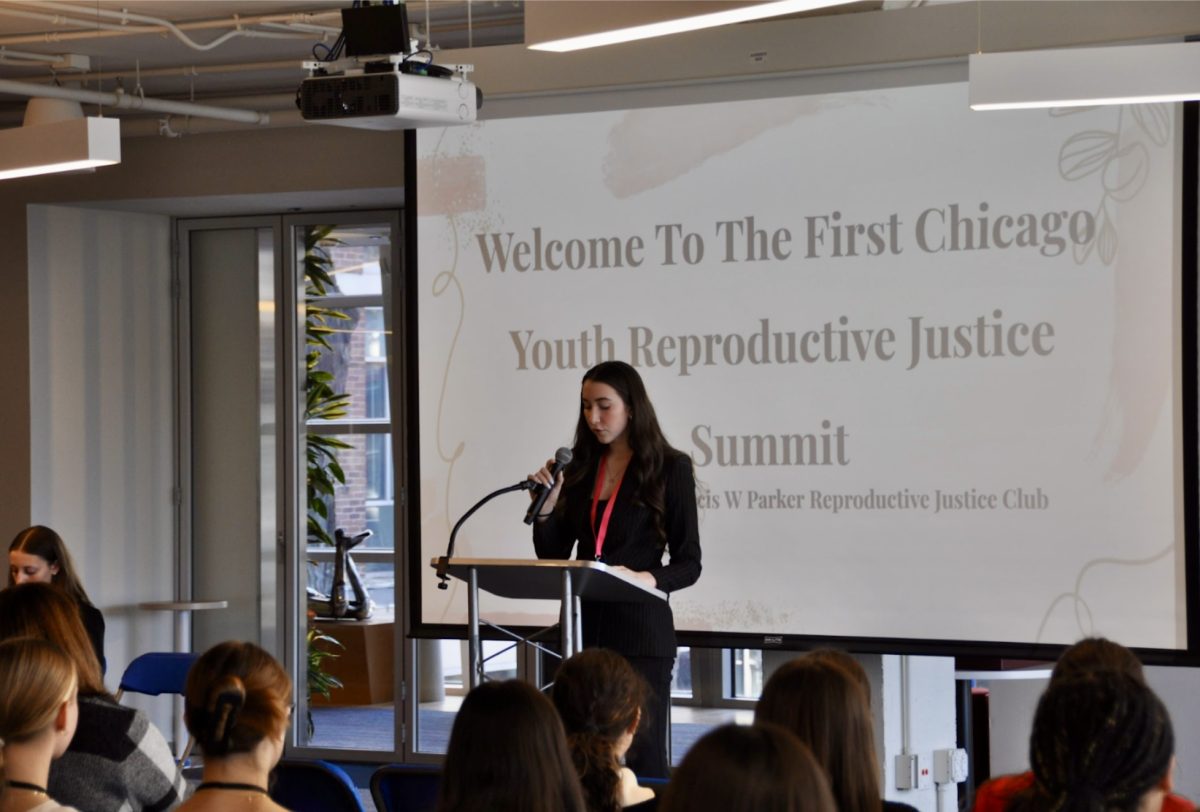 Graysen Pendry presents to an audience at Chicago's first ever Youth Reproductive Justice Summit. Photo by Beckett Nikitas